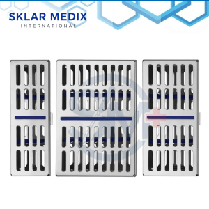 Set of three stainless steel dental sterilization cassette trays with hinged locking lids and silicone inserts, designed to hold 5, 7, and 10 dental or surgical instruments.