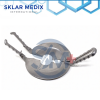 Percy amputation retractor shield with circular fenestrated plate and detachable handles for surgical amputation procedures.